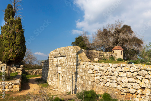 Remains of ancient fortifications on Mount Tabor in Israel. Abandoned stone ruins of a church. photo