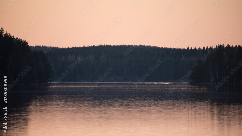 Fototapeta premium Lake scenery around sunset on a late spring evening in conifer forests of Finland