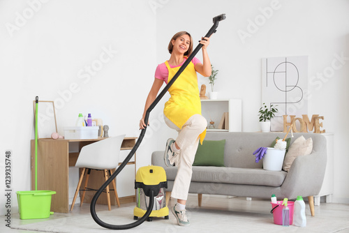 Happy young woman cleaning ...