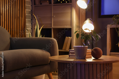Interior of modern living room with sofa and coffee table at night