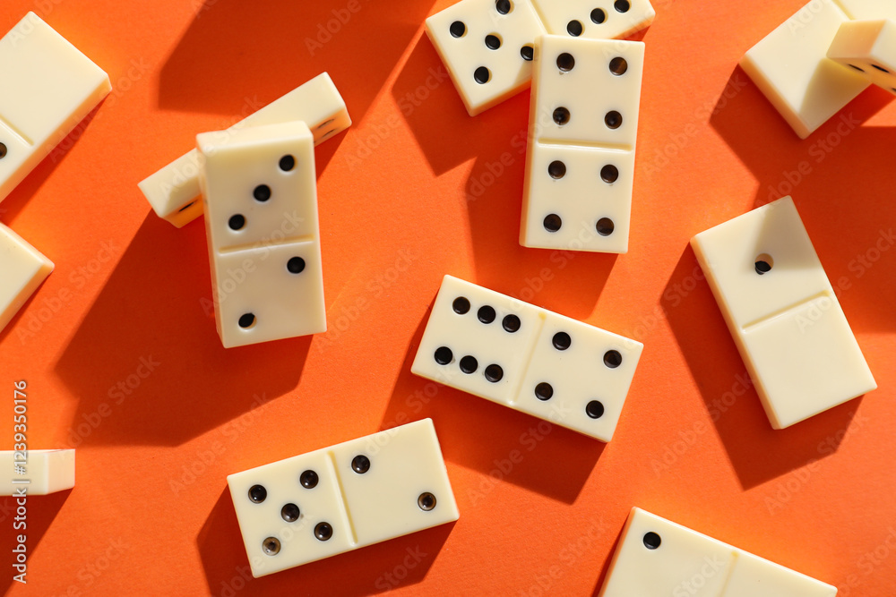 White dominos blocks on orange background White dominos blocks on orange background