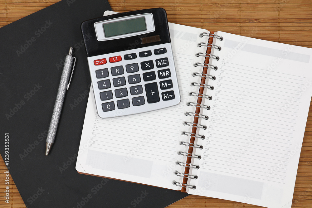 Notebook, calculator and pen in top view. Concept secretary day with copy space. Greeting card. Notebook, calculator and pen in top view. Concept secretary day with copy space. Greeting card.