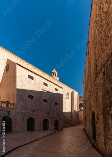 Dubrovnik Old Town. Photo of empty streets, old architecture. Shady alley inside the old town.