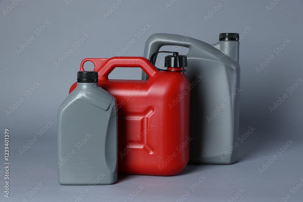 Many different plastic canisters on light grey background Many different plastic canisters on light grey background
