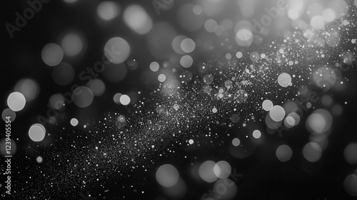 Black and white abstract background with bokeh lights and particles, creating a sparkling, dreamy effect.