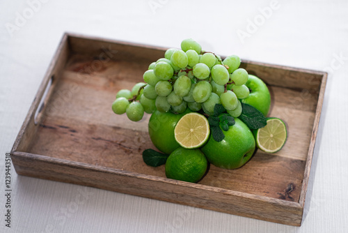 Fruit in a wooden box on a white background