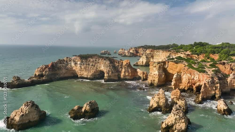Aerial view of the beach in rocky lagoon near Lagos town, Algarve province, Portugal. Aerial view of the beach in rocky lagoon near Lagos town, Algarve province, Portugal.