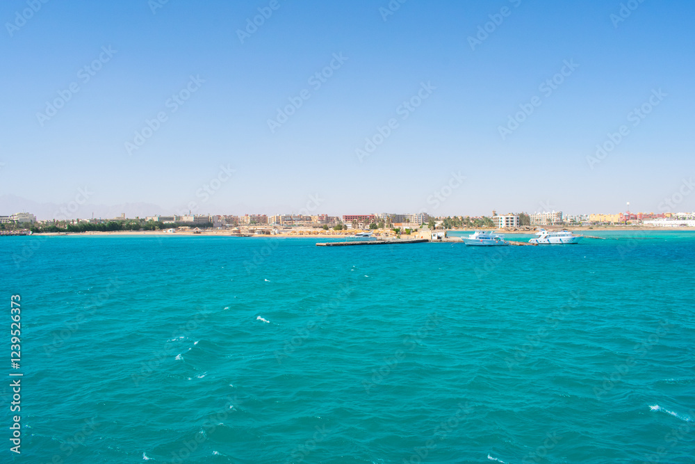 View from boat on Red Sea And Hurghada in Egypt. Cristal clear water and View at city. View from boat on Red Sea And Hurghada in Egypt. Cristal clear water and View at city.