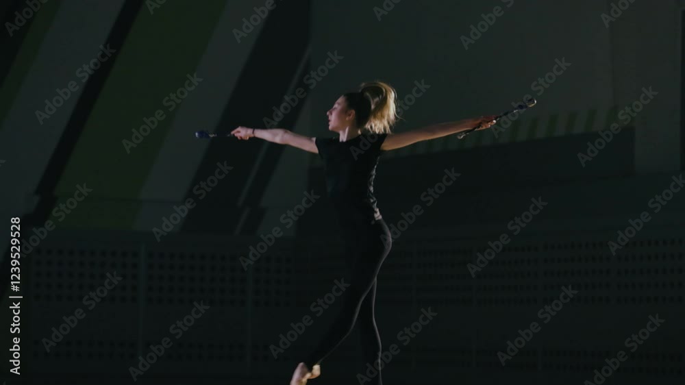 Rhythmic gymnast girl training in the gym. Rhythmic gymnast girl training in the gym.