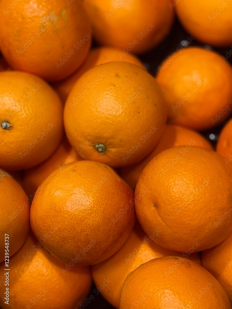 A bunch of fresh oranges at the supermarket A bunch of fresh oranges at the supermarket