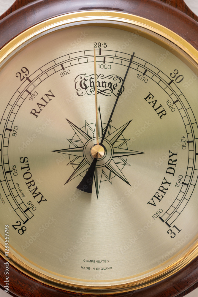 Close up of the face of an aneroid barometer Close up of the face of an aneroid barometer