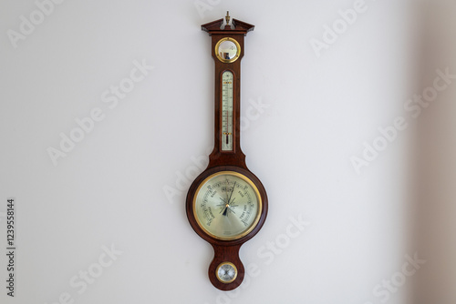 Close up of the face of an aneroid barometer