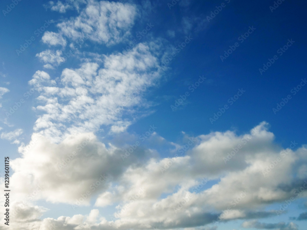 Warm cloudy blue sky. Nature background for design or sky replacement. Warm cloudy blue sky. Nature background for design or sky replacement.