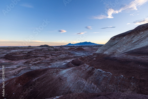 The colors of the otherworldly Bentonite Hills of Utah change and become more dramatic as the sun starts to set. As the sun nears setting at the blue hour the colors are the most beautiful. photo