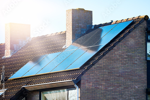Solar panels on the roof of modern European house, close up