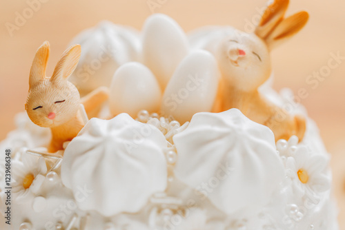 Easter pastries with Easter decor on a wooden table. Spring festive desserts. Catholic and Orthodox holidays table.Cute Bunny Decoration on Cake 