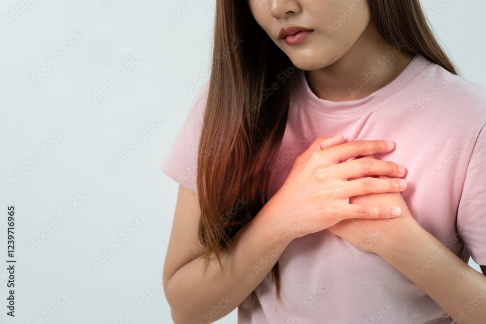 hand hold chest with heart attack symptoms, asian woman have chest pain caused by heart disease, leak, dilatation, enlarged coronary heart, press on the chest with a painful expression hand hold chest with heart attack symptoms, asian woman have chest pain caused by heart disease, leak, dilatation, enlarged coronary heart, press on the chest with a painful expression