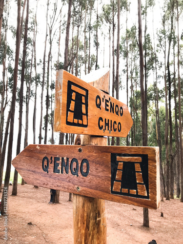 Wooden sign showing direction to q'enqo archaeological site in cusco, peru photo