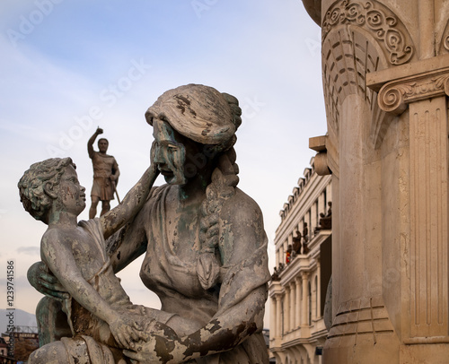 The Mothers of Macedonia Fountain statues in Rebellion Square, with statue of Philip II of Macedon, father of Alexander the Great at behind photo