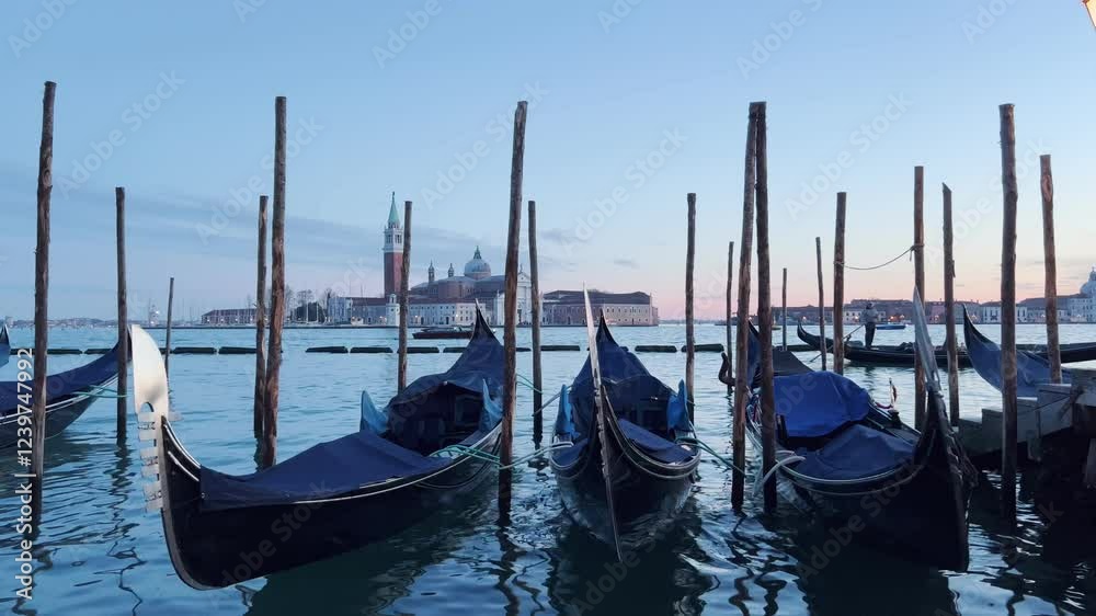 A beautiful evening in Venice, Italy, capturing the stunning view of the sea with a serene set of boats gently floating on the water. A beautiful evening in Venice, Italy, capturing the stunning view of the sea with a serene set of boats gently floating on the water.