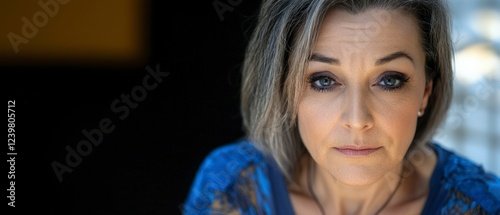 Sad Middle Aged Woman Portrait  Emotional Closeup  Blue Dress  Studio Shot