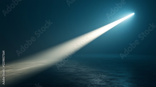 A single beam of light illuminates a dark surface