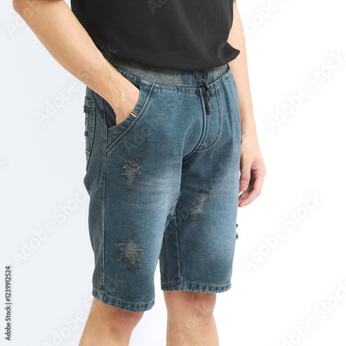 Model showcases stylish denim shorts paired with a simple black shirt, ideal for casual summer occasions and comfortable outings