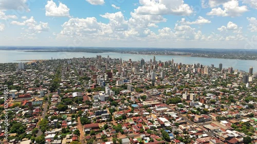 Panoramic view of Posadas city in Misiones, Argentina, with the Paraná River and the city of Encarnación, Paraguay, in the background.