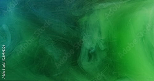 Glitter smoke. Ink water splash. Defocused green blue color sparkling texture haze swirl wave spreading abstract art background.