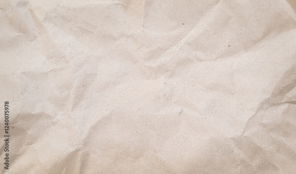 Crumpled piece of brown paper grunge background. Recycled craft paper texture background. Crumpled piece of brown paper grunge background. Recycled craft paper texture background.