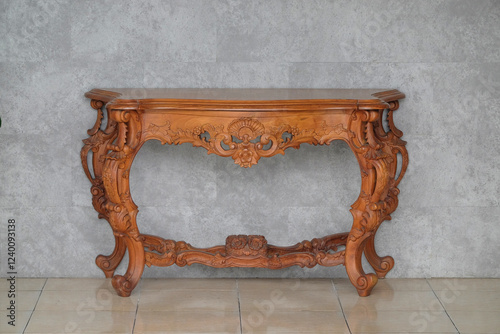 Close up Carved wooden table brown background. Javanese carved teak wood. Classic wooden table. For product or item placement design. For graphic design or banner background