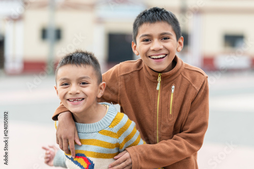 Portrait of two latin children on the street