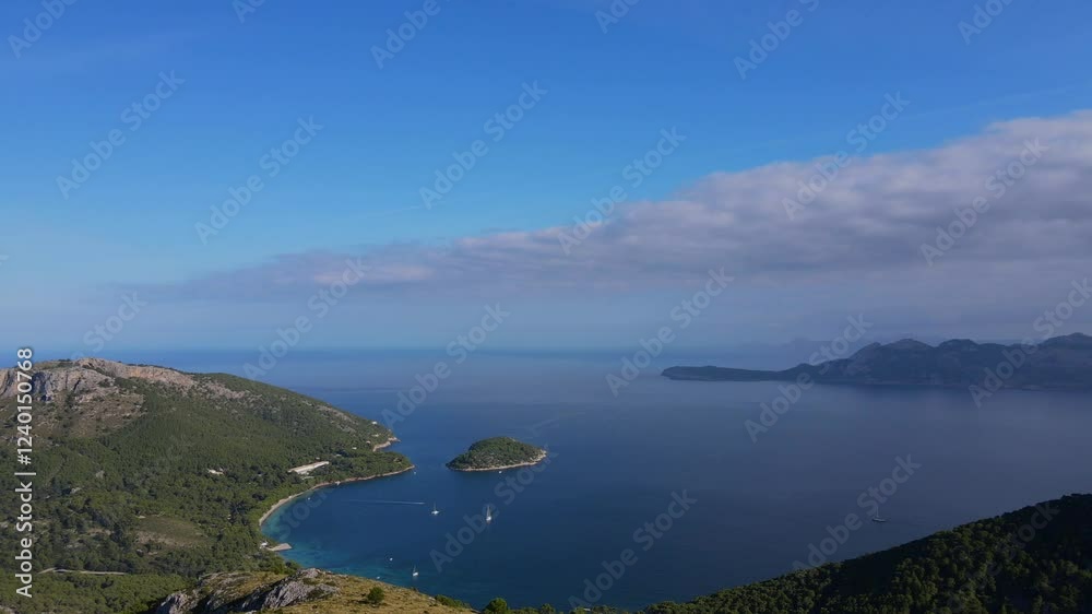 Experience stunning vistas overlooking the tranquil waters and lush landscapes of Cap Formentor from Mirador es Colomer. Enjoy the beauty of nature in Mallorca’s Tramuntana region. Experience stunning vistas overlooking the tranquil waters and lush landscapes of Cap Formentor from Mirador es Colomer. Enjoy the beauty of nature in Mallorca’s Tramuntana region.