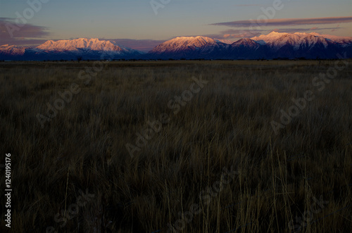 Wallpaper Mural sunrise in the mountains, large field with snowy mountains, sunset on snow-capped mountains, Utah snow, Utah, bare field with snowy mpuntains Torontodigital.ca