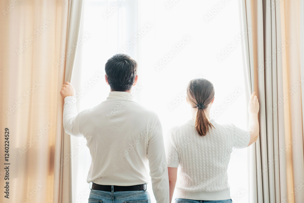 Man and woman looking out window concept of travel or family relationships. Man and woman looking out window concept of travel or family relationships.