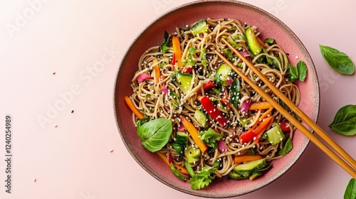 Delicious noodle bowl with colorful vegetables and herbs served in a stylish ...