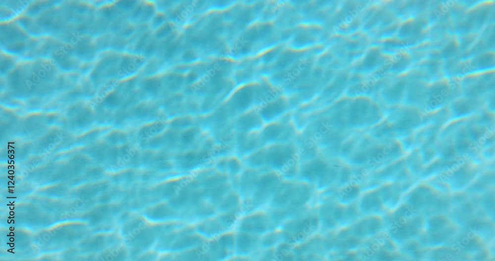 Vibrant blue pool water surface with gentle ripples and sunlight reflections, offering a soothing and refreshing look. Perfect for backgrounds, summer themes, and wellness designs. Vibrant blue pool water surface with gentle ripples and sunlight reflections, offering a soothing and refreshing look. Perfect for backgrounds, summer themes, and wellness designs.