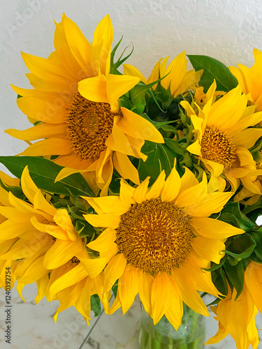 Obraz na płótnie A bouquet of sunflowers is close. Vertical photography. Yellow color w salonie