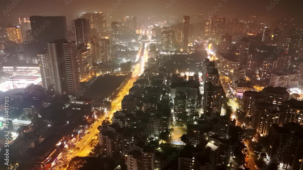 Aerial shot lively city at night bathed in bright light
