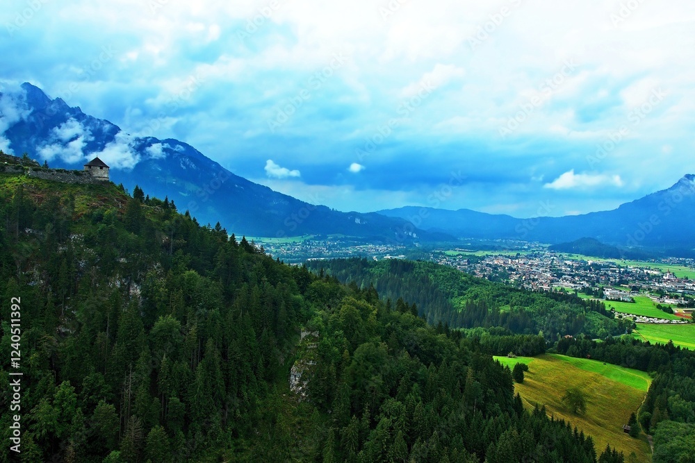 Obraz premium Austrian Alps - view of the chapel in the ruins of Ehrenberg Castle and the town of Reutte in the Lechtal Alps
