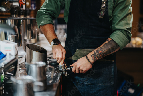 Photos A close-up of a skilled barista tamping coffee grounds into a portafilter at a cafe