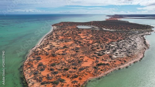 Aerial view of beautiful coastline and tranquil ocean with red sand and lush vegetation, Francois Peron National Park, Shark Bay, Australia. photo