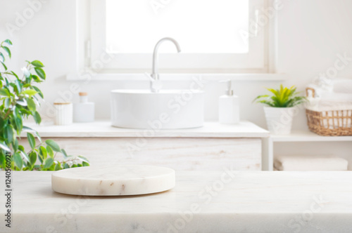 Marble round podium and table for product display on blurred bathroom window interior background