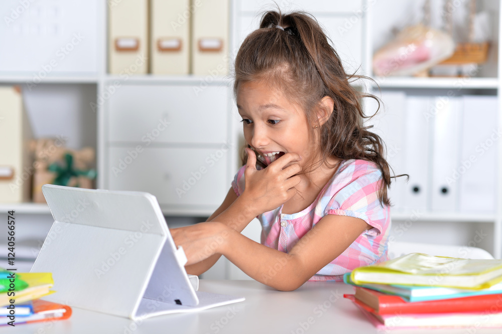 Portrait of girl studing with tablet at classroom