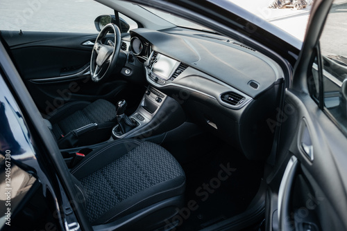 Wallpaper Mural Modern car interior, leather steering wheel, climate control, large navigation screen, fabric on the seats, deflectors on the car panel. Interior details. Torontodigital.ca