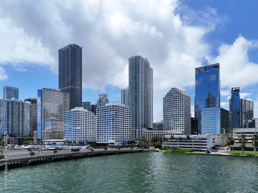 Aerial view of modern skyscrapers and waterfront at sunset, Brickell Key, United States. Aerial view of modern skyscrapers and waterfront at sunset, Brickell Key, United States.