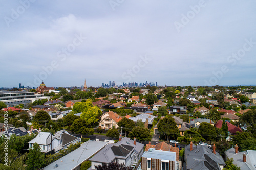 Aerial view of beautiful suburban houses and greenery with a skyline, Kew, Victoria, Australia. photo