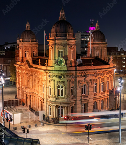 Aerial view of illuminated queen victoria square and city hall at night with traffic and street lights, Hull, United Kingdom. photo