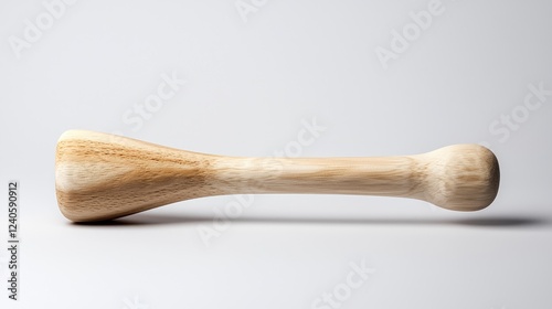 Wooden muddler on white background, food prep photo