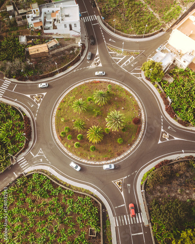 Aerial view of roundabout surrounded by palm trees and urban infrastructure, Los Llanos de Aridane, Spain. photo